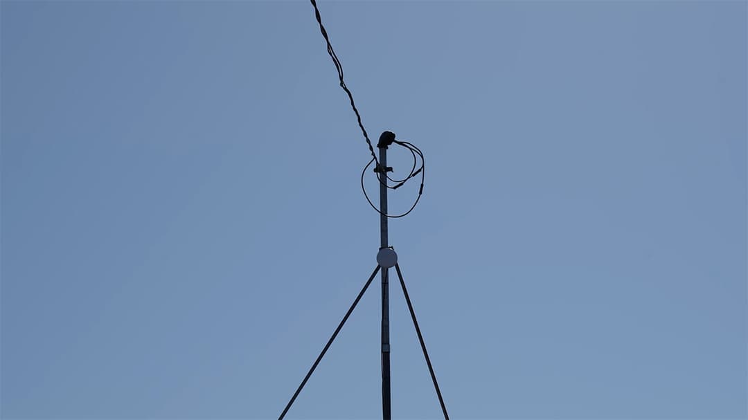 UniFi radio link mounted on a pole to extend the enterprise network across the facility.