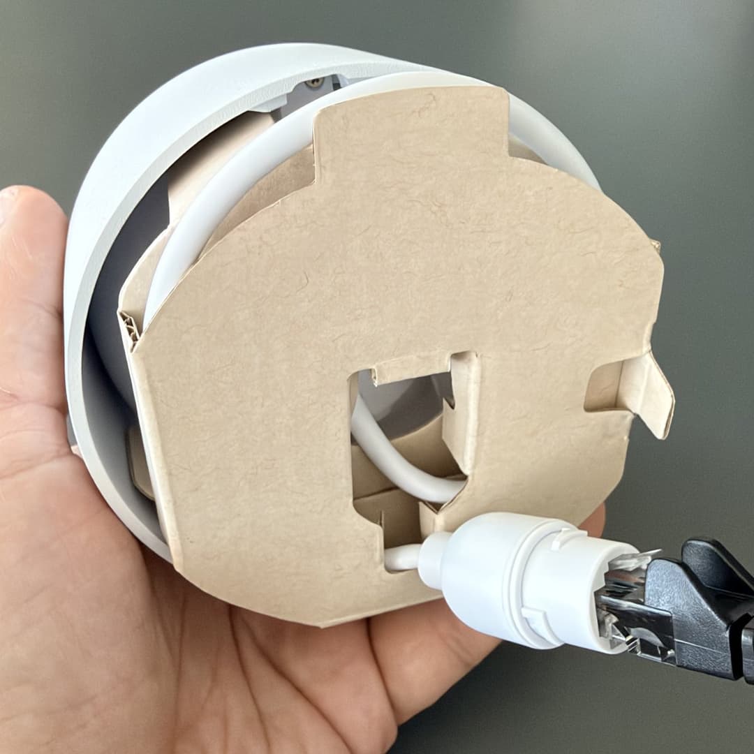 G6 Turret camera out of the box with a network cable connected for staging
