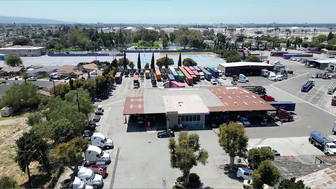 Aerial drone view of Rainbow Transport Tank Cleaners commercial truck yard facility