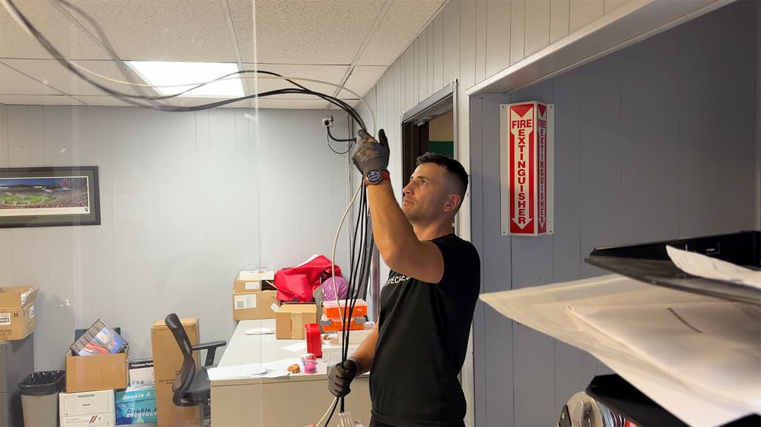 YesTechie team removing outdated network hardware and messy legacy wiring.