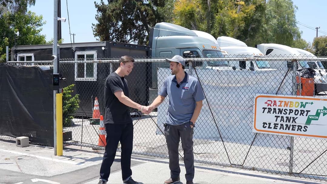 YesTechie lead engineer consulting with Rainbow Transport Tank Cleaners manager on site